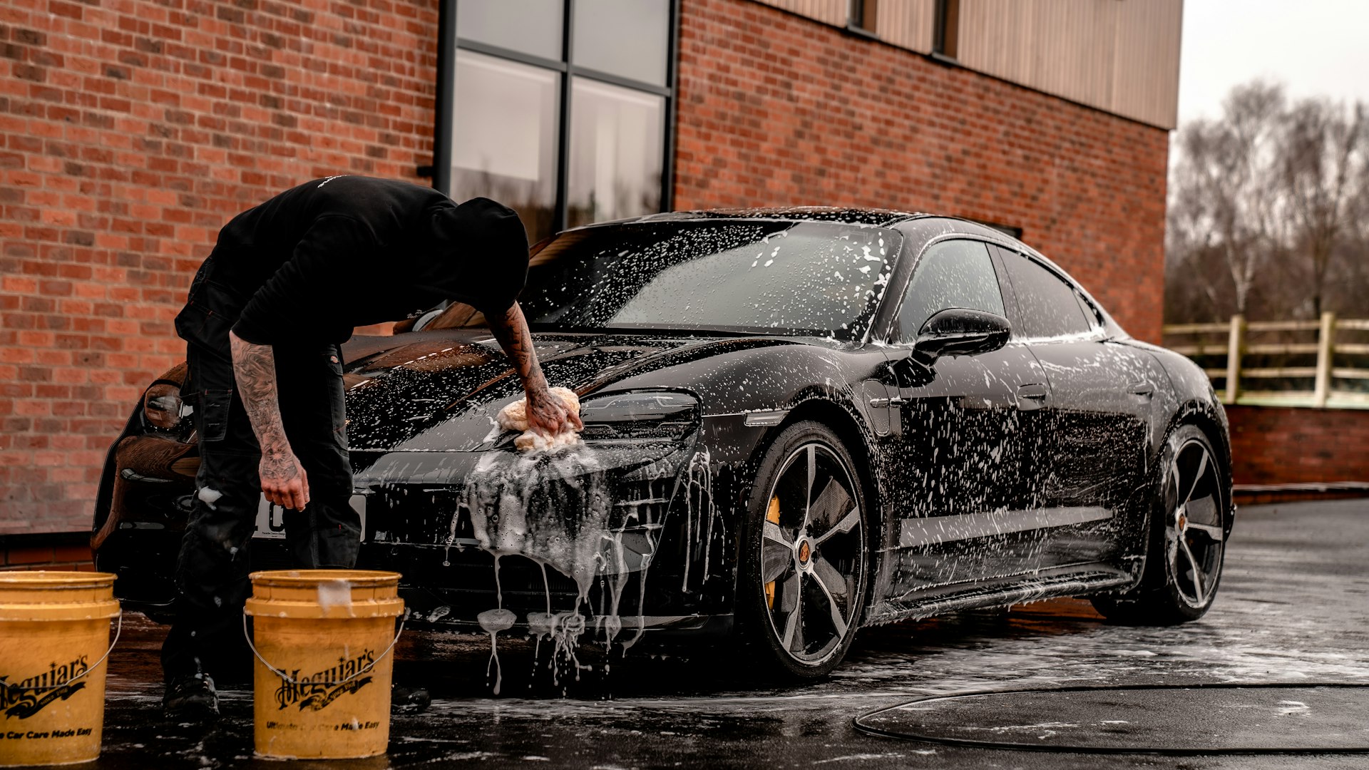 Professional auto detailing showing mirror-like car gloss finish
